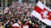 BELARUS – Protesters with old Belarusian national flags march during an opposition supporters rally in Minsk, September 6, 2020